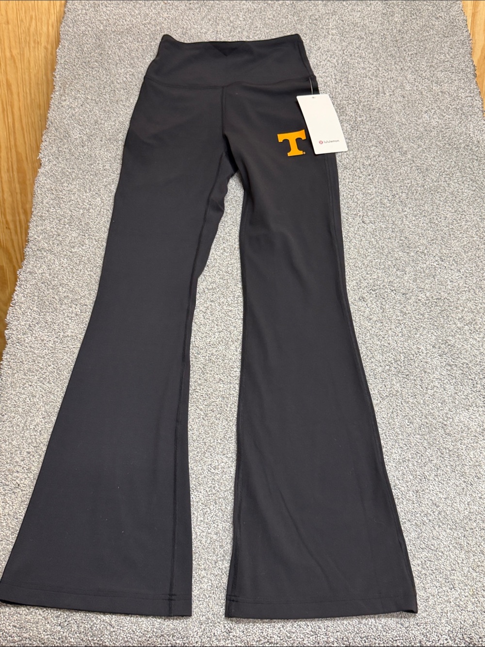 lululemon athletica Black Flare Yoga Pants with Orange 'T' Logo